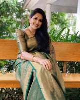 Mitera Green Woven Designer Party Wear Soft Silk Lichi Silk Saree .