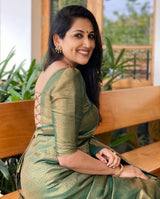 Mitera Green Woven Designer Party Wear Soft Silk Lichi Silk Saree .